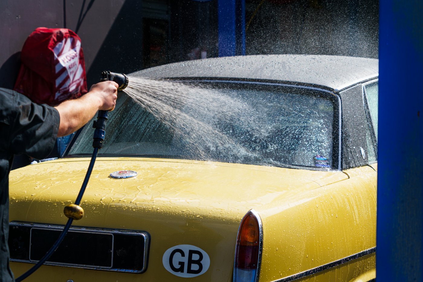 Premium hand wash — rinsing down a classic Rover at Auto Super Shoppe Kapiti